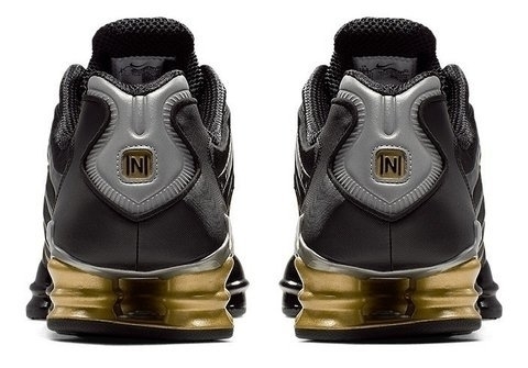 nike shox masculino preto e dourado