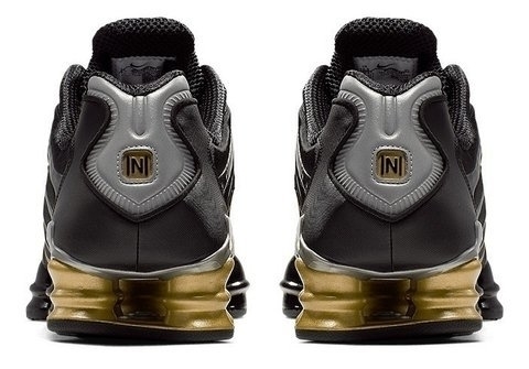 nike shox dourado masculino